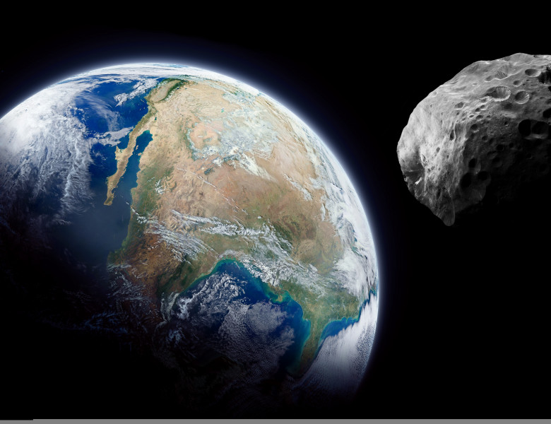 Planet,Earth,And,Big,Asteroid,In,The,Space.,Dark,Background.