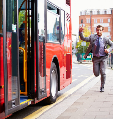 Businessman,Running,To,Catch,Bus,Stop