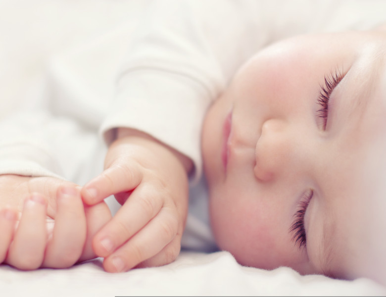 Close-up,Portrait,Of,A,Beautiful,Sleeping,Baby,On,White