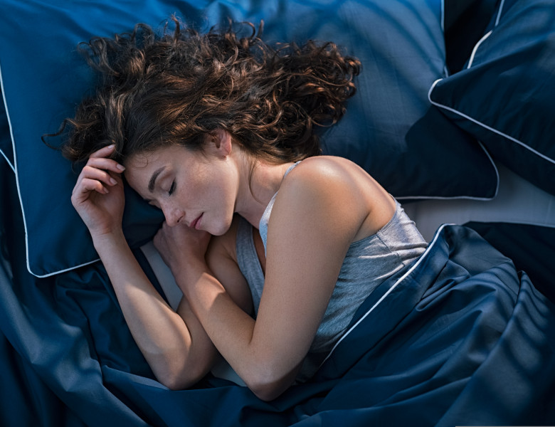Top,View,Of,Young,Woman,Sleeping,On,Side,In,Her