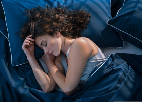 Top,View,Of,Young,Woman,Sleeping,On,Side,In,Her