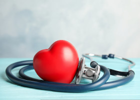 Stethoscope,And,Red,Heart,On,Wooden,Table.,Cardiology,Concept