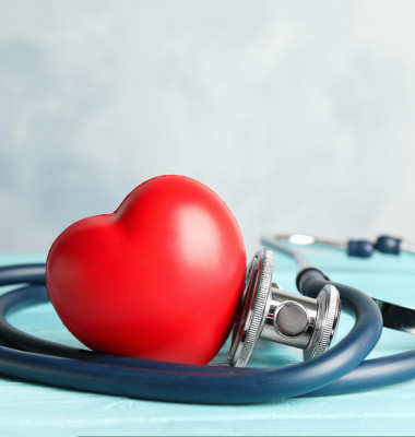 Stethoscope,And,Red,Heart,On,Wooden,Table.,Cardiology,Concept