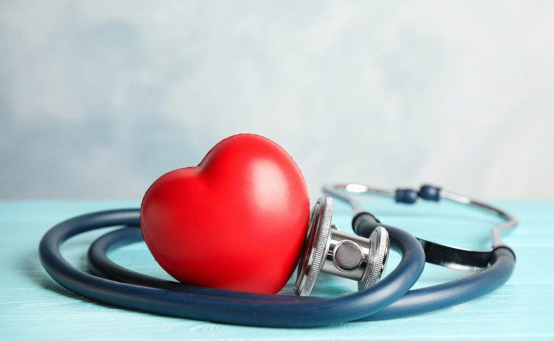 Stethoscope,And,Red,Heart,On,Wooden,Table.,Cardiology,Concept