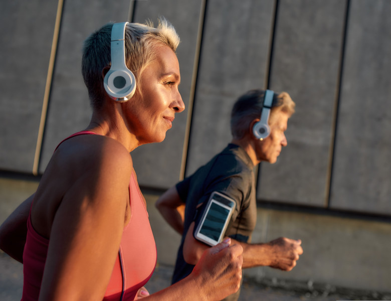 Morning,Jog.,Happy,And,Healthy,Middle-aged,Couple,In,Headphones,Running