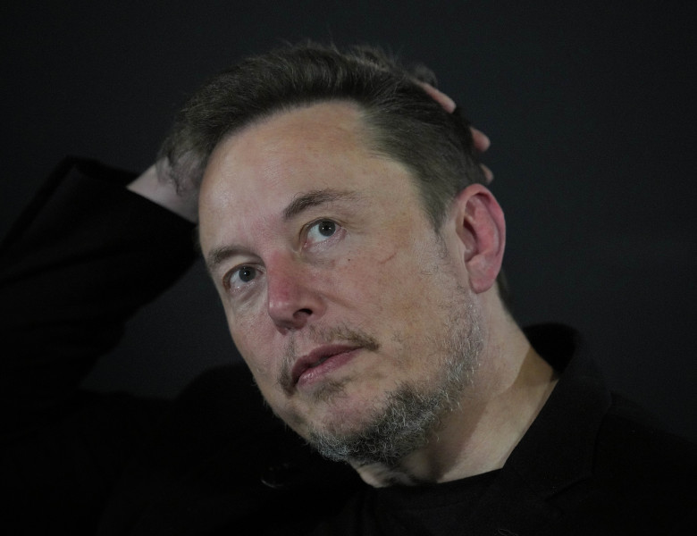 Tesla and SpaceX's CEO Elon Musk reacts during an in-conversation event with Britain's Prime Minister Rishi Sunak in London, Thursday, Nov. 2, 2023. Sunak discussed AI with Elon Musk in a conversation that is played on the social network X, which Musk own