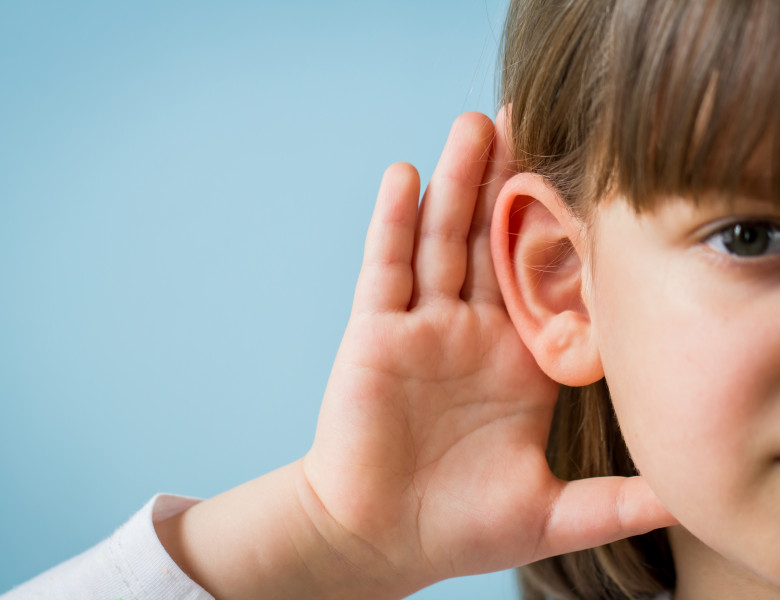 Child,With,Hearing,Problem,On,Blue,Background.,Hearing,Loss,In