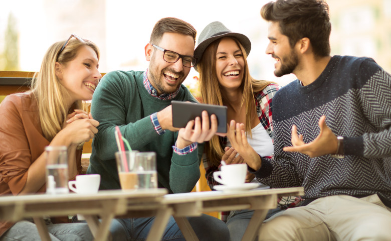 Group,Of,Four,Friends,Having,A,Coffee,Together.,Two,Women