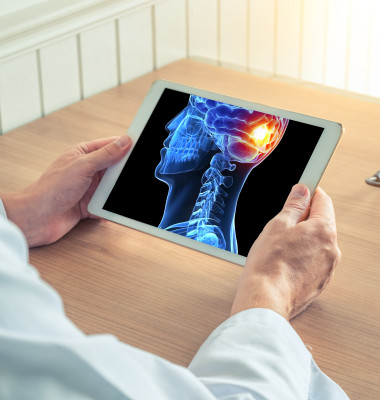 Doctor,Holding-a,Digital,Tablet,With,X-ray,Of,3d,Skull,With