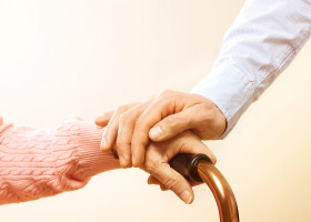 Senior,Elderly,Woman,Holding,Quad,Walking,Cane,With,Her,Male