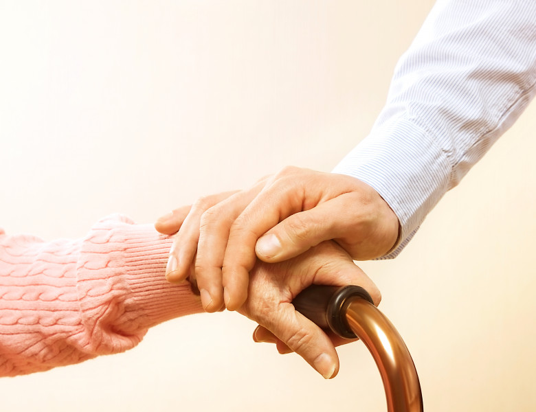 Senior,Elderly,Woman,Holding,Quad,Walking,Cane,With,Her,Male