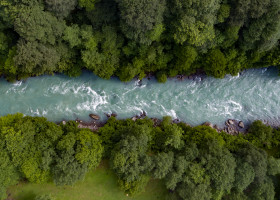 Mountain,Emerald,River,With,Stone,Coast,And,Forest,/,Strong