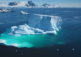 Giant,Iceberg,Towering,Melting,Blue,Underwater,Ice.,Natural,Beauty,And