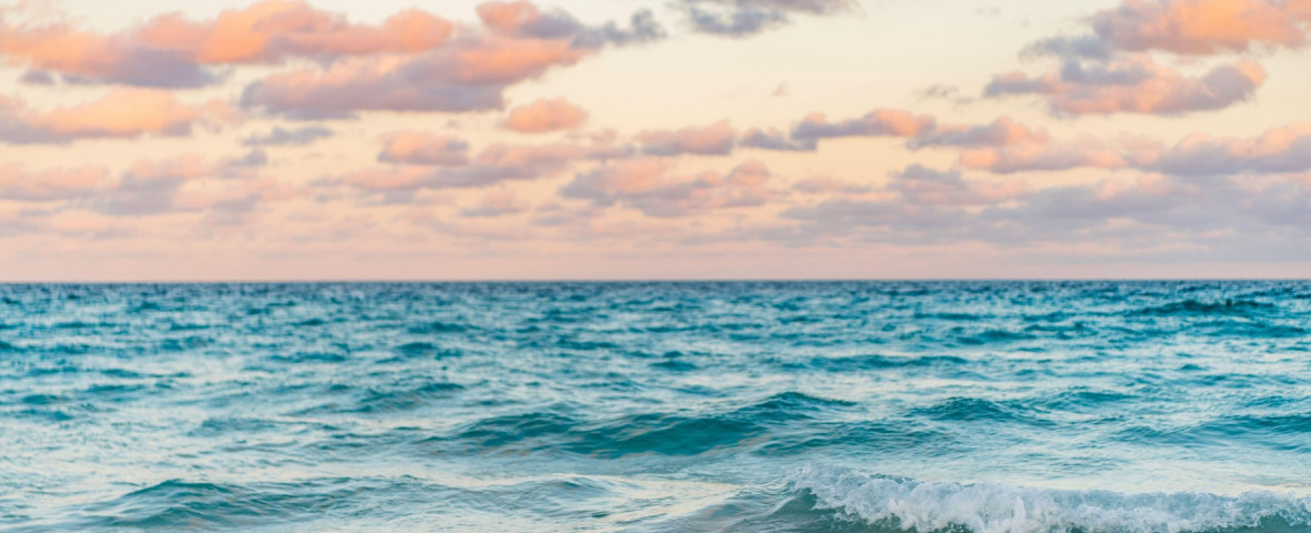 Sea horizon view. Cloudy sky and seascape at summer vacation. Skyscape with sea horizon. Calm horizon view at sea sunrise. Romantic summer vacation