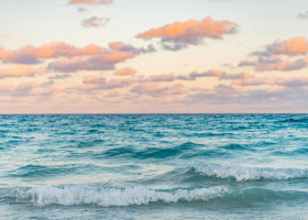 Sea horizon view. Cloudy sky and seascape at summer vacation. Skyscape with sea horizon. Calm horizon view at sea sunrise. Romantic summer vacation