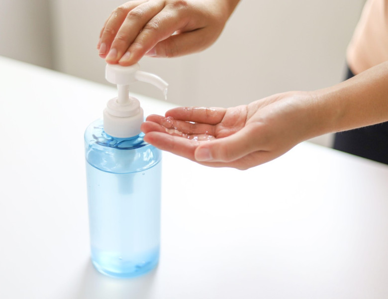 Hand applying Alcohol gel sanitazer liquid cleaning hands for prevent corona virus covid-19