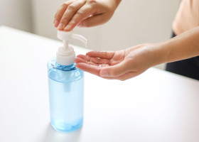 Hand applying Alcohol gel sanitazer liquid cleaning hands for prevent corona virus covid-19