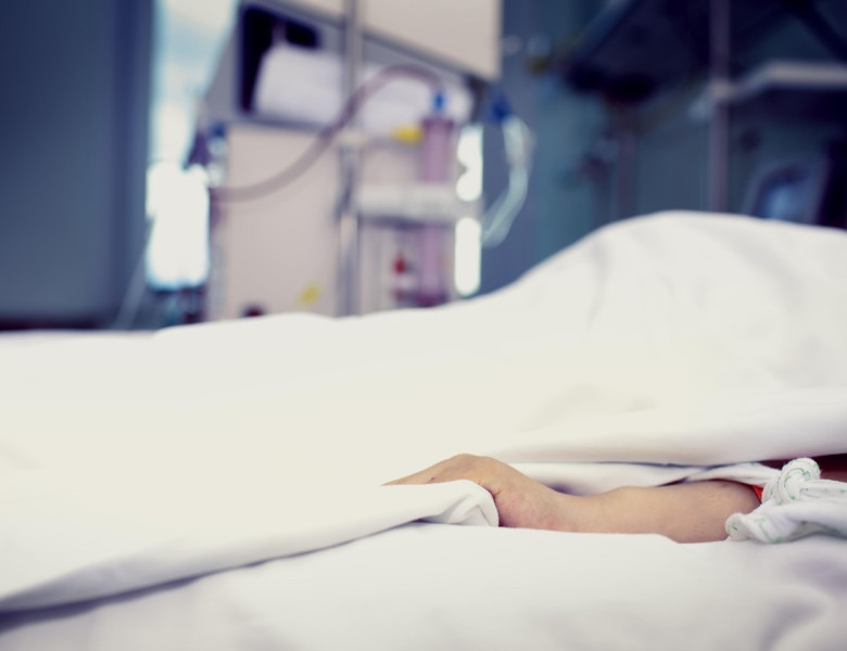 Patient confined to bed in hospital room.
