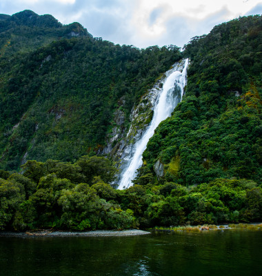 Waterfall,Roaring,Down,The,Mountains,Of,Milford,Sound,,New,Zeeland