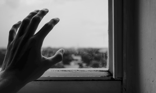 close-up-photography-of-hand-near-window-1264438