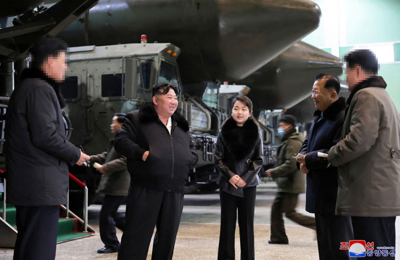 This undated picture released from North Korea's official Korean Central News Agency (KCNA) via KNS on January 5, 2024 shows North Korea's leader Kim Jong Un (centre L) inspecting an important military vehicle production plant with his daughter Ju Ae (centre R) at an undisclosed location in North Korea.,Image: 834308679, License: Rights-managed, Restrictions: South Korea OUT / REPUBLIC OF KOREA OUT - NOTE: FACES BLURRED FROM SOURCE ---EDITORS NOTE--- RESTRICTED TO EDITORIAL USE - MANDATORY CREDIT 