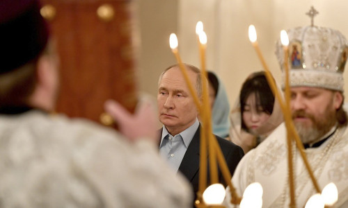 Vladimir Putin at an Orthodox Christmas service with families of troops killed in his war in Ukraine.