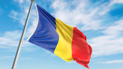 3d,Rendering,Romania,Flag,Waving,In,The,Wind,On,Flagpole.