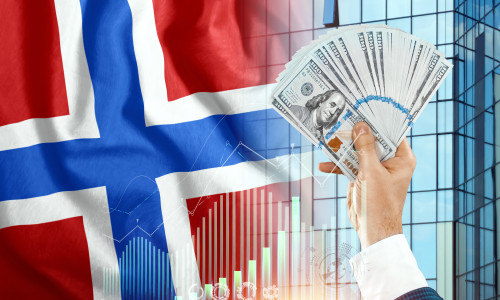 Money,In,A,Man's,Hand,Against,The,Background,Of,The