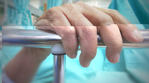 The,Old,Patient,Man,Hand,Is,Holding,Guard,Rails,Of