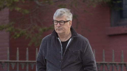 A very downcast Alec baldwin is seen going for a walk alone in NYC