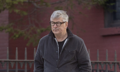 A very downcast Alec baldwin is seen going for a walk alone in NYC