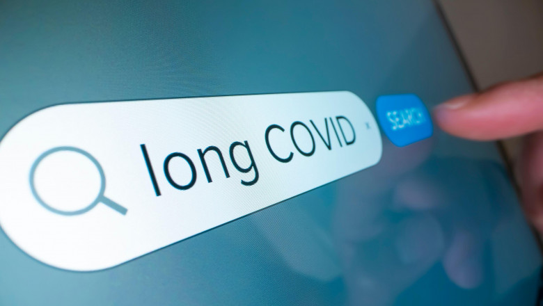 Close-up view of searching information on Long COVID on the internet