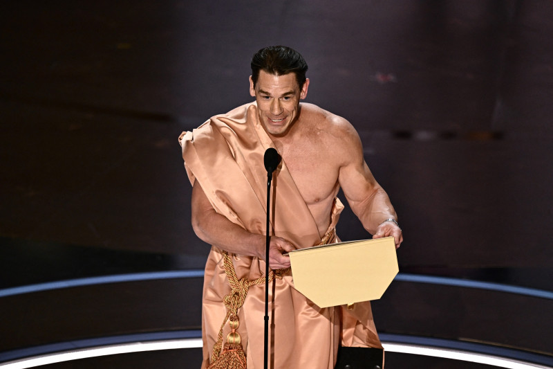 US actor John Cena presents the award for Best Costume Design onstage during the 96th Annual Academy Awards at the Dolby Theatre in Hollywood, California on March 10, 2024