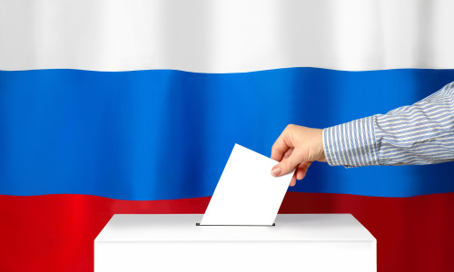 Voter's,Hand,Drops,The,Ballot,Into,The,Ballot,Box.,Against