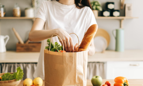 Caucasian,Woman,Hold,Eco,Shopping,Bag,With,Fresh,Vegetables,And