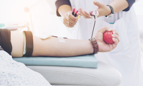 Blood,Donor,At,Donation,With,A,Bouncy,Ball,Holding,In
