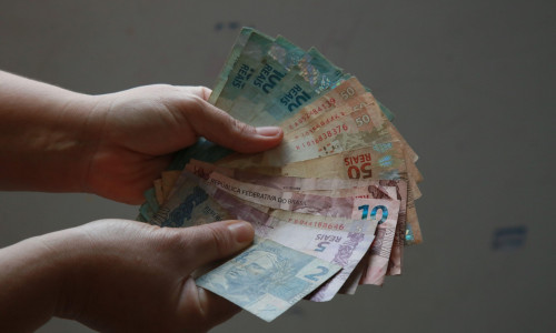 salvador, bahia, brazil - october 4, 2021: hand counting Real banknotes, Brazilian currency.