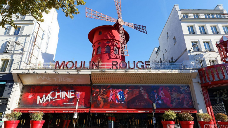 The Moulin Rouge , Paris, France. It is a famous cabaret built in 1889, locating in the Paris red-light district of Pigalle