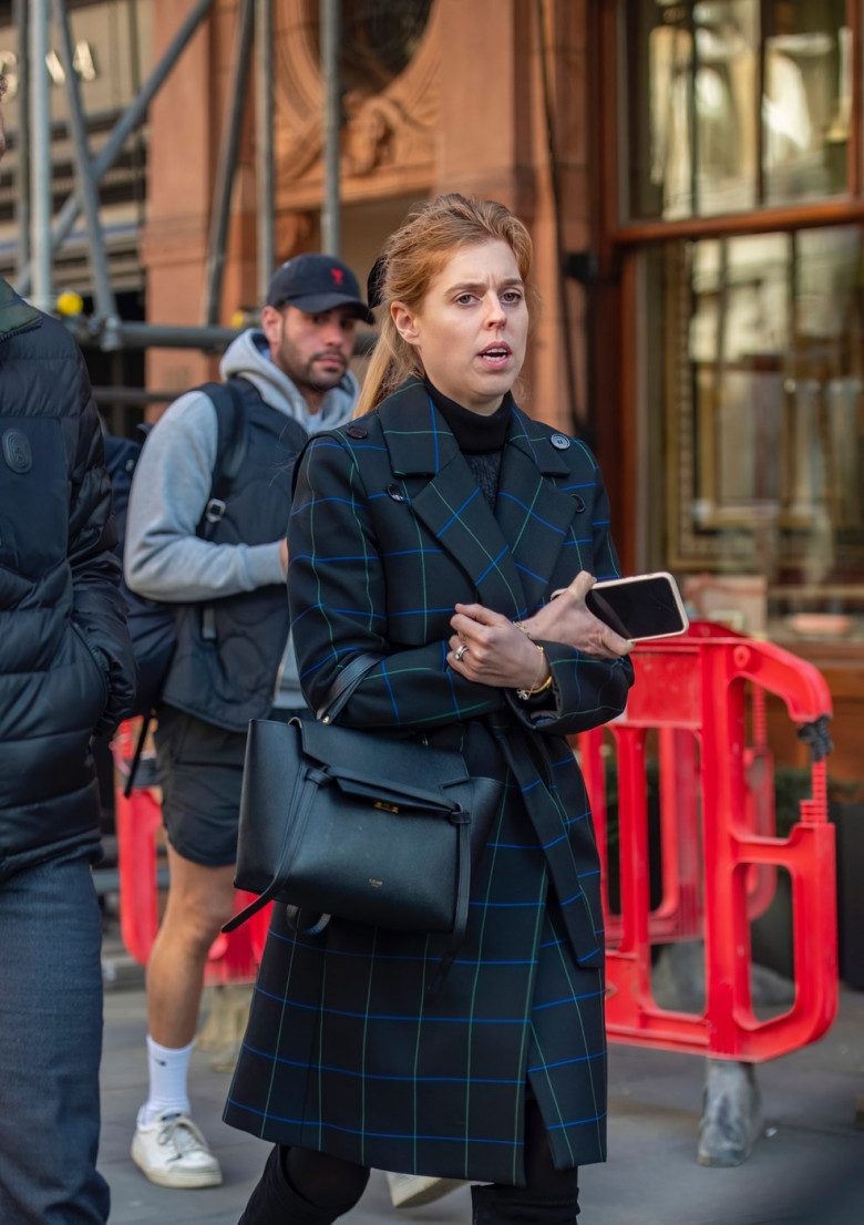 *EXCLUSIVE* *NO SUBSCRIPTIONS* Princess Beatrice steps out in Mayfair copying her mum Sarah Ferguson's signature hair style with a black velvet bow with the words ‘love me’ in gold.