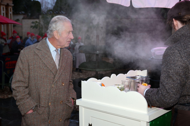 King Charles III is handed a glass of mulled cider as meets students, tutors and graduates during a Celebration of Craft reception at Highgrove Gardens in Tetbury, hosted by The King's Foundation. Picture date: Friday December 8, 2023.