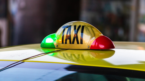 Detail,Of,Taxi,Sign,On,Yellow,Taxi,Car,In,Bucharest,