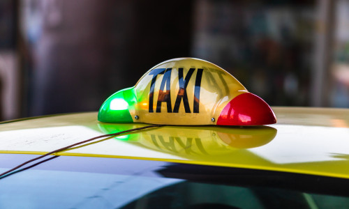Detail,Of,Taxi,Sign,On,Yellow,Taxi,Car,In,Bucharest,