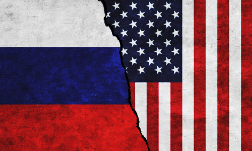 Usa,And,Russia,Painted,Flags,On,A,Wall,With,A