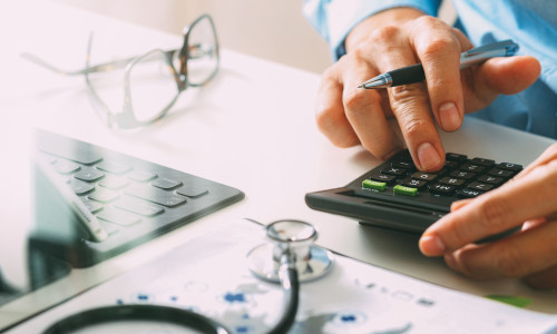 Healthcare,Costs,And,Fees,Concept.hand,Of,Smart,Doctor,Used,A