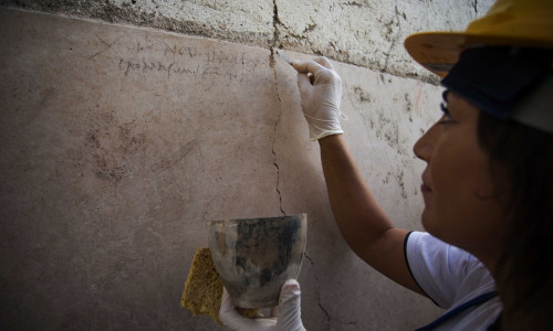 Italy, the ancient Roman city of Pompeii: Archeologists discover a new graffiti that could put an end to scholars' debate about the exact historical date of the eruption of Mt. Vesuvius that destroyed the city in 79 AD