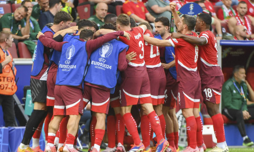 COLOGNE, GERMANY - JUNE 15: Switzerland squad celebrates Michel Aebischer of Switzerland (not showed) for his goal durin