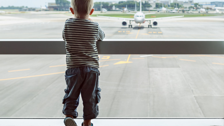 Little,Baby,Boy,Waiting,Boarding,To,Flight,In,Airport,Transit