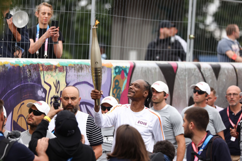 Snoop Dogg carrying the Olympic torch, Paris 2024 Olympic Games, Day One, Paris, France - 26 Jul 2024