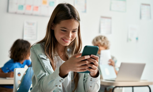 Happy,Latin,Hispanic,Kid,Girl,School,Student,Using,Smartphone,In