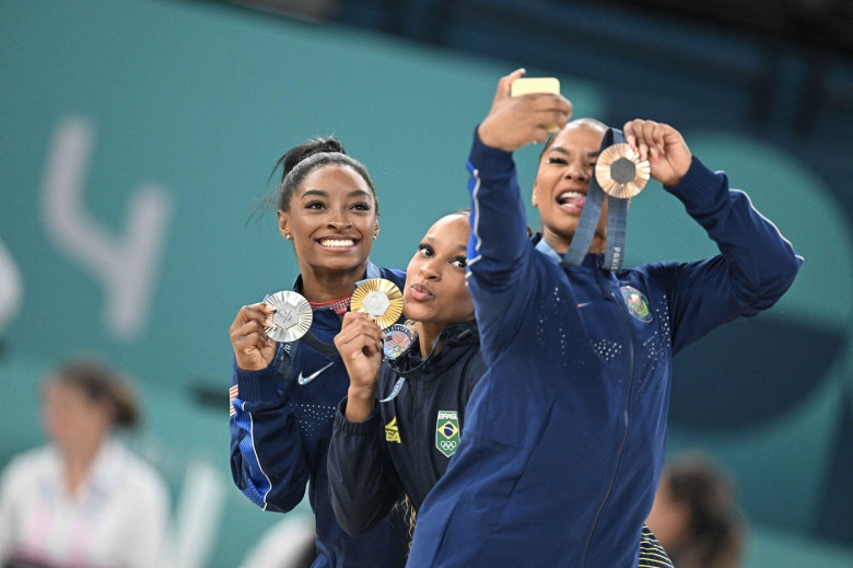 Paris, France. 05th Aug, 2024. (L to R) Silver Medallist Simone Biles of Team United States, Gold Medallist Rebeca Andrade and Bronze medallist Jordan Chiles of Team USA pose during the podium ceremony for the artistic gymnastics women's floor exercise ev